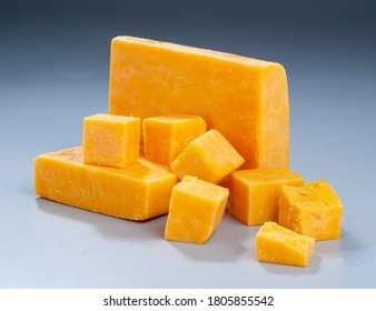 Red Cheddar Block And Cubes On Gradient Background