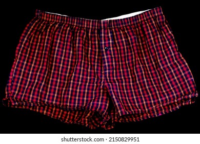 Red Chequered Mens Boxer Shorts On A Black Background