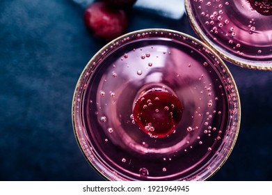 Red Cherry Cocktail Drink  Isolated On Black Background. Top View.