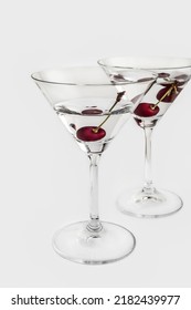 A  Red Cherry In Dry Martini On A White Background