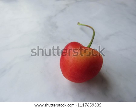 red cherry on a table