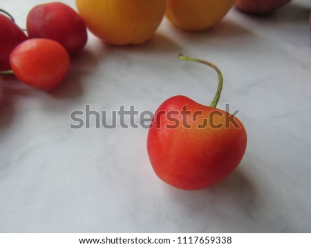 red cherry on a table