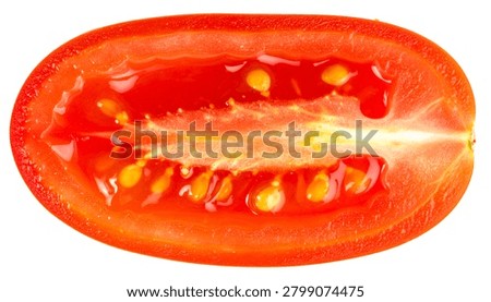 Red cherry tomato squashed perfectly flat revealing inner seeds and rich wet juices isolated on white.