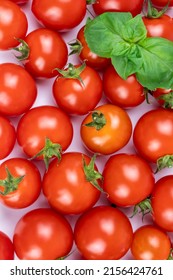 Red cherry tomatoes and basil texture and background