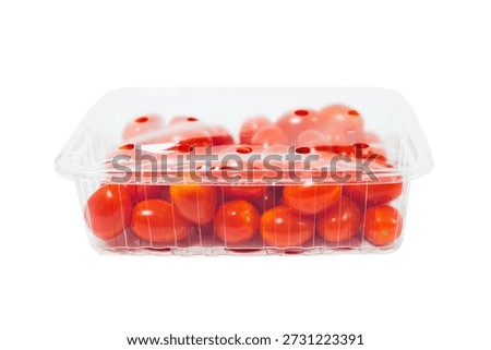 Red cherry tomatoes in a plastic tray isolated on white background. Plastic tray