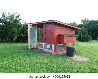 Red Chicken Coop Made Of Wood And Metal Screen        