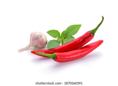 Red chili and garlic basil leaves on white background - Powered by Shutterstock