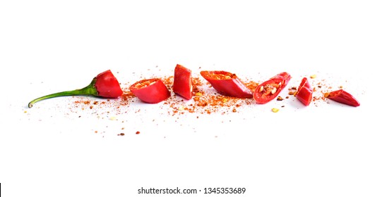 Red chili pepper, cut into pieces and isolated on white background. Hot spice, red chili pepper and chili powder.  - Shutterstock ID 1345353689