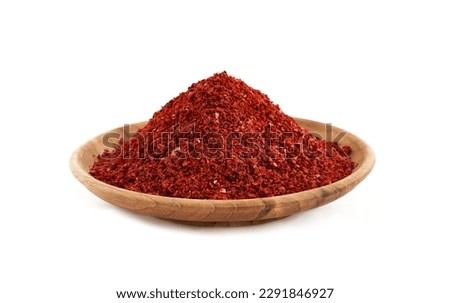 red chili pepper flake or ground powder coarse in wood bowl isolated on white background Gochugaru. the pile of red chili pepper flake or ground powder coarse isolated.red chili pepper flake or ground