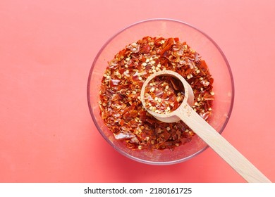 Red Chili Pepper Flakes On Red Background 