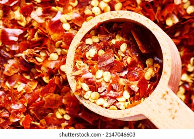 Red Chili Pepper Flakes In A Spoon Close Up 