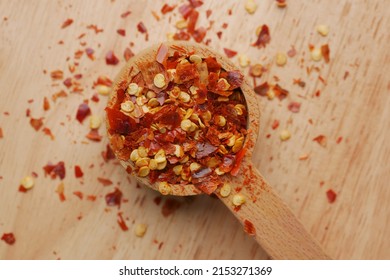 Red Chili Pepper Flakes In Wooden Spoon 