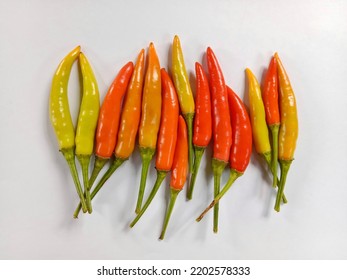 Red chili peppers. Red hot chili peppers isolated on white background. Colorful chili peppers. Spicy red chili peppers. Flat lay, top view. 