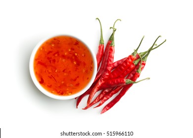 Red Chili Peppers And Chili Sauce Isolated On White Background.