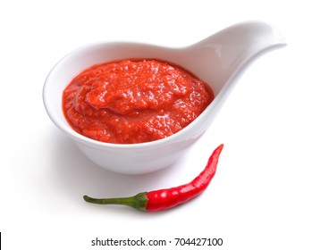 Red Chili Sauce In The Sauce Boat. With Pepper. Isolated On White Background.