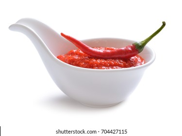 Red Chili Sauce In The Sauce Boat. With Pepper. Isolated On White Background.