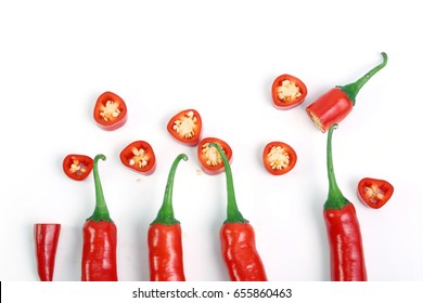 Red Chilli Or Chili Peppers Cut Into Pieces Isolated On A White Background.