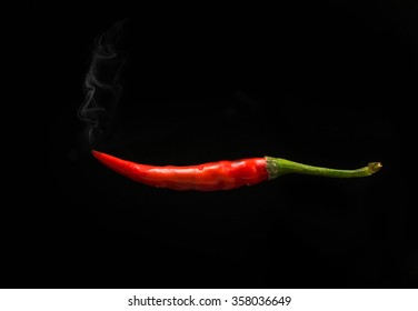 Red  Chilli Pepper With Smoke On Isolated Black Background,  With Clipping Path