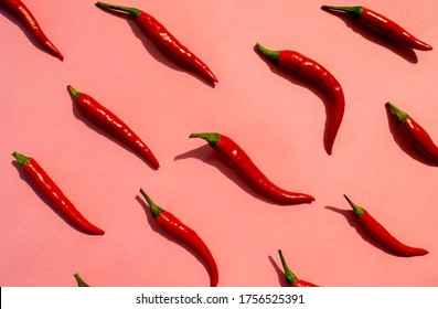 Red chilli peppers pattern on pink background. Top view. Hot pepper flat lay. Chili wallpaper  - Powered by Shutterstock