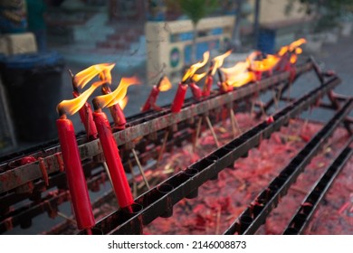 Red Chinese Candles In Shrine