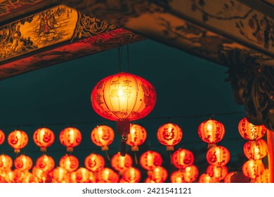 Red Chinese lantern(Translation Hieroglyph text Happy New Year) hanging in a row during day time for Chinese new year celebration. - Powered by Shutterstock