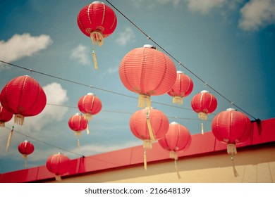 Red Chinese Paper Lanterns against a Blue Sky. Horizontal filtered shot - Powered by Shutterstock