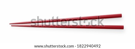 Red chopsticks on a white background