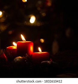 Red Christmas candles decoration light with bokeh depth of field. Warn color space background.
