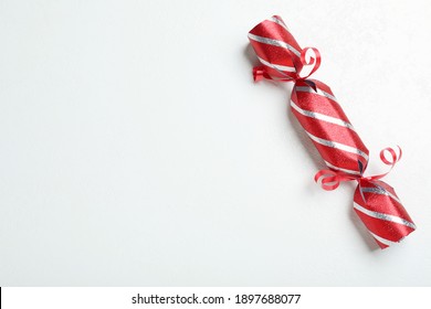 Red Christmas Cracker On White Background, Top View. Space For Text