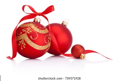 Red christmas decoration baubles with ribbon bow isolated on white background