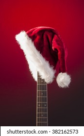 Red Christmas Hat On Guitar