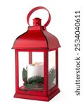 Red Christmas lantern with white candle with pine branches isolated on a white background