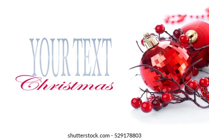 Red Christmas and New Year Decoration isolated on white background. Border art design with holiday baubles. Decorated with ball, holly berry. Space for your text