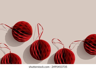 Red Christmas paper balls on beige background Scandinavian Christmas honeycomb ornaments. New year paper baubles, Modern xmas decoration, minimal style winter holiday pattern, flat lay, top view - Powered by Shutterstock - Get 15% off with code: PIKWIZARD15