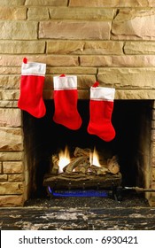 Red Christmas Stockings On Fireplace