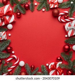 Red Christmas template for design with festive frame on red background. Flat lay, top view and copy space for text - Shutterstock ID 2043070109