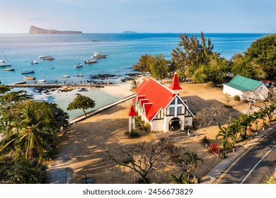 Red church at Cap Malheureux village, Mauritius Island. Notre Dame de Auxiliatrice, rural church with red roof in Cap Malheureux tropical village on Mauritius island, Indian Ocean.