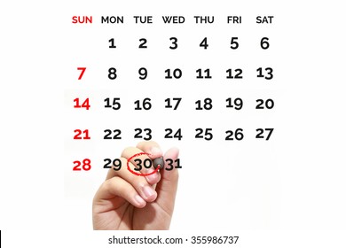 Red circle. Businessman mark on the calendar at 30