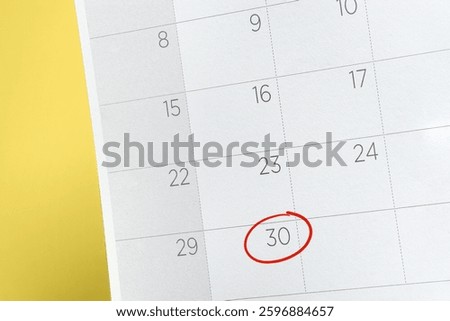 Red circle. Close up of a date 30 with red circles on a calendar. Concept Last days of month.