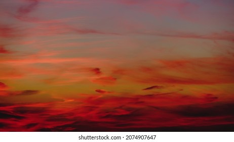 Red Cirrus Clouds On The Setting Evening Sky After Sunset, Time Lapse