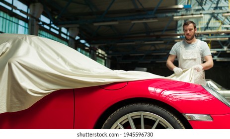 Red Classic Car  Unveiling In The Garage