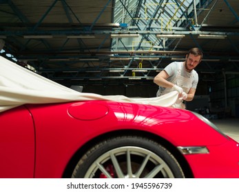 Red Classic Car  Unveiling In The Garage