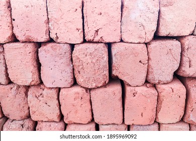 Red Clay Bricks Stacked And Lined Up In A Pile