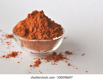 Red Clay Powder Montmorillonite In A Glass Bowl Isolated