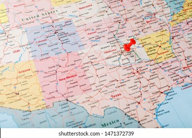 Red clerical needle on a map of the USA, Oklahoma and the Capital of Oklahoma City. Close up map of Oklahoma with red tack, US map pin