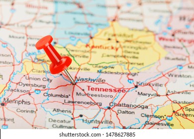 Red clerical needle on a map of USA, South Tennessee and the capital Nashville. Close up map of South Tennessee with red tack