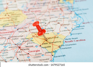 Red clerical needle on a map of USA, South South Carolina and the capital Columbia. Close up map of South South Carolina with red tack, United States map pin