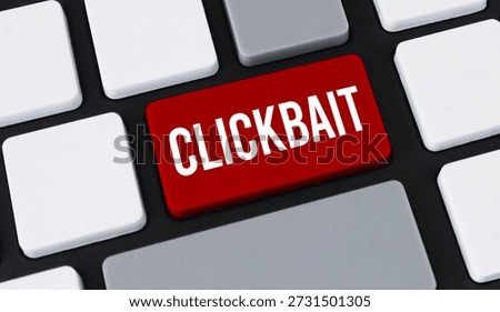Red clickbait button on computer keyboard. Concept of misleading headlines, internet deception and web traffic.