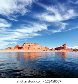 red cliffs reflected in the water of the lake Powell