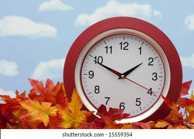 Red Clock On Fall Leaves â?? The Fall Time Change